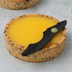 a cookie with a knife sticking out of it