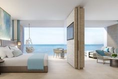 a bedroom with an ocean view is shown