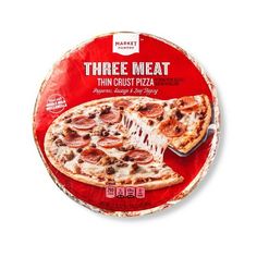 a box of three meat thin crust pizza on a white background with the lid removed