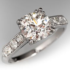 a diamond engagement ring with diamonds on it