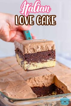 a piece of chocolate cake being lifted from a glass dish with the words italian love cake above it