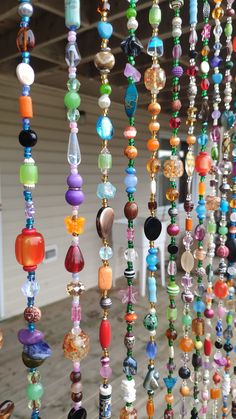 many different colored beads hanging from the ceiling