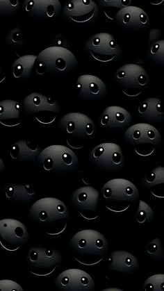 many black balls with faces and eyes are shown in this image, as if they were floating