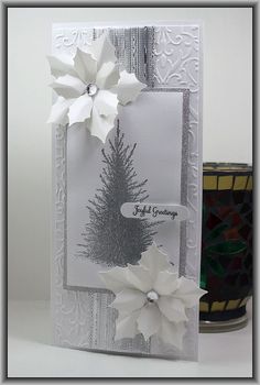 a card with white paper flowers on it