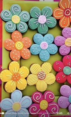 colorful cookies decorated with flowers and swirls