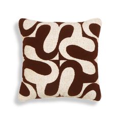 a brown and white pillow on a white background