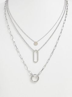 This silver-tone necklace features a solid disk, cutout oval, and cutout circle charms that layers together to create the perfect delicate statement. Lobster clasp. 19-24. 75” length with 5” extender . Base metals. Imported . The best plus size women's silver-tone geo charm layered necklace necklaces in silver. Layered Silver Necklaces Simple, Unique Silver Necklaces, Silver Jewelry Aesthetic Necklaces, Necklace Layering Ideas Silver, Cute Silver Necklaces, Layered Silver Necklaces, Silver Necklaces Layered, Pendant Necklace Outfit, Silver Layered Necklaces