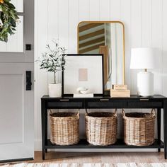 the entryway is decorated with wicker baskets