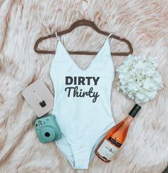 Tired of looking for the perfect bachelorette party swimwear with no luck? Visit our website to discover team bride swimwear, dirty thirty swimwear, bridal party swimsuits, pink bridal swimsuits, white bridal swimsuit, bridesmaid swimsuit, birthday party swimwear, bride swimwear, and swimwear for the bride. #bachelorettepartyswimwear #brideswimwear #teambride #bachelorettepartyideas #bacheloretteparty Bride Swimwear, Thirty Party, Swimsuits Pink, Swimsuit Onepiece