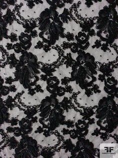 This black floral double-scalloped corded lace designer fashion fabric is extremely elegant and high quality. SKU: 12270 Content: Polyester Color: Black Width: 52 inches This fabric is a last cut and no longer in production. Once sold out, we are unable to get more.