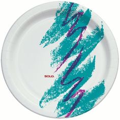 a white paper plate with blue and purple paint splattered on the surface,