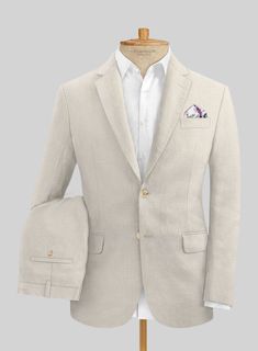 Discover the authentic essence of grandeur with the addition of our Italian Prato Beige Linen Suit. However, cut from a pure linen fabric that brings durable, soft and highly breathable features, it makes a brilliant choice for summer wear. At the same time, lean into the transitional luxury that elevates the warm weather looks by including an efficiently tailored solid beige suit that keeps you dry and cool while maintaining the classic stance which stands apart while appearing on summer outings or heading for the traveling destination. 
 
 Look Includes   Italian Prato Beige Linen Fabric  Two Button Jacket Style  Notch Lapel  Faux Horn Beige Buttons  Single Vent  Three Cuff Buttons  Two Welted Back Pockets on Trousers   You can change the look during customization if required. 
 
 Lining Timeless Beige Linen Suit, Luxury Linen Suits, Beige Linen Suit For Wedding, Fitted Beige Linen Suit, Cream Linen Single-breasted Suit, Elegant Fitted Linen Blazer, Classic Beige Linen Suits, Timeless Linen Suit, Single Breasted Fitted Linen Suit