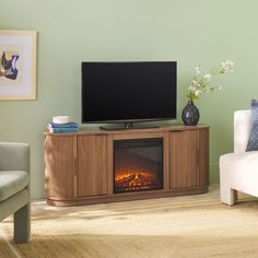 a living room with a television and fireplace