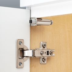 a close up view of a door hinge with the latch on it's side