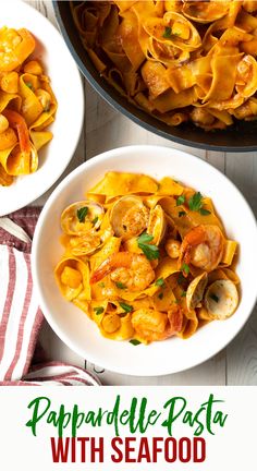 pasta with seafood is served in a white bowl