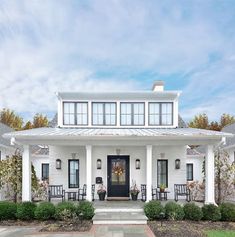 a white house with black doors and windows