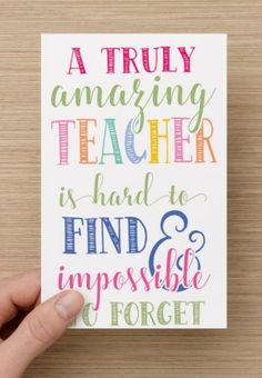 a hand holding up a card with the words, a truly amazing teacher is hard to find