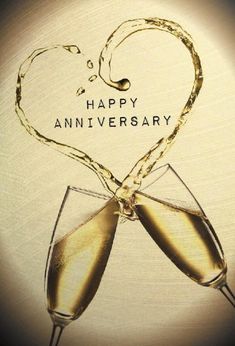 two glasses of champagne are being toasted with the words happy anniversary