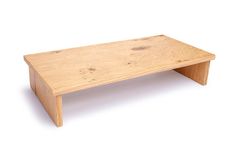 a wooden coffee table sitting on top of a white floor