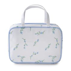 a white and blue lunch bag with flowers on it