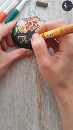 someone is painting an easter egg with crayons