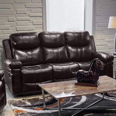 a living room filled with brown leather furniture