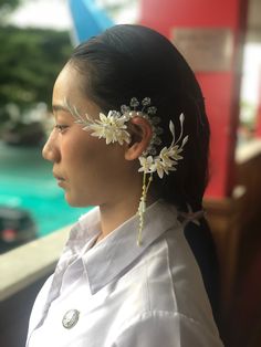 a woman with flowers in her hair