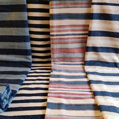 several different colored striped fabrics are folded together