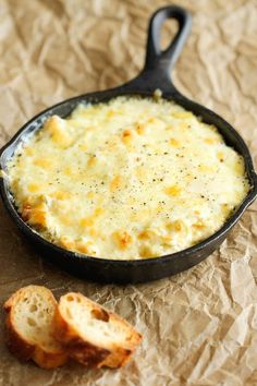 a cast iron skillet filled with cheesy bread