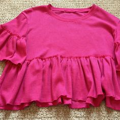 Never Worn. Great Condition. Comfortable. Size Small Cotton Tops With Ruffle Hem In Solid Color, Cotton Top With Ruffle Hem In Solid Color, Solid Cotton Top With Ruffle Hem, Solid Color Crew Neck Top With Ruffles, Spring Blouse With Ruffle Hem And Crew Neck, Casual Ruffle Hem Tops For Fall, Casual Ruffle Hem Top For Brunch, Casual Pink Blouse With Ruffle Hem, Casual Crew Neck Top With Ruffle Hem