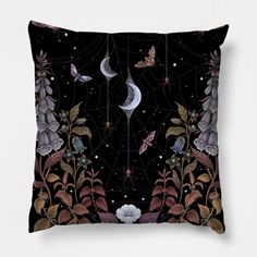 a black pillow with flowers and butterflies in the night sky, on a white background