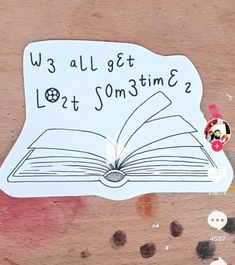 an open book with the words we all get lost time on it and mickey mouse sticker