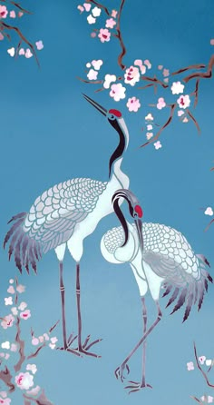 two cranes standing next to each other on a blue background with pink and white flowers