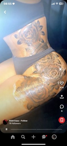 a woman's thigh with tattoos on it