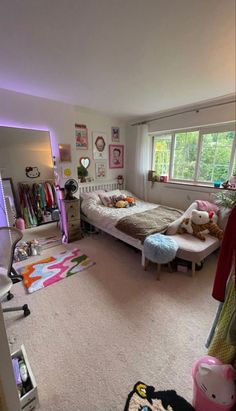 a bedroom with two twin beds and lots of clutter on the carpeted floor