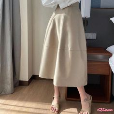 Qteee - Versatile High-Waisted Half-Length Umbrella Skirt in Khaki Casual A-line Bottoms For Day Out, Casual A-line Bottoms In Solid Color, High Waist Solid Beige Skirt, Casual A-line Solid Color Bottoms, Non-stretch Beige Midi Skirt, Casual Stretch Beige Skirt, Casual Beige Flared Skirt, Beige Stretch Flared Skirt, High Waist Beige Stretch Skirt