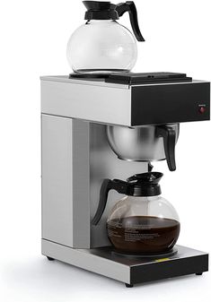 an espresso machine with a coffee pot on top