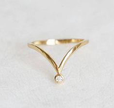 V shaped diamond band, Available in 14k/18k rose, white and yellow gold, platinum Product details Gemstone: 2mm diamond, 0.03ct, G, VS, can be replaced also with other gemstones per request solid gold band width: 1.5mm Size: 3-8 (Larger and smaller sizes are available. Priced upon request. Please contact us.) Procedure information Please select material, your size, and type of stone from the drop-down menu on the right side of the listing. Production starts once the payment is received and requi V Shape Wedding Ring, V Shape Ring, Gold V Ring, Wedding Band V Shape, V Shaped Stacking Ring, Solid Gold Band, Matching Band, Gold Diamond Rings, Diamond Sizes