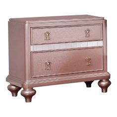 a pink dresser with two drawers on it