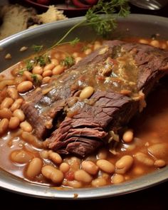 a pot roast with beans in a sauce