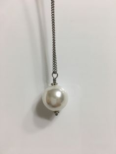 "Available in 15\", 16\", 18, 14mm large single white shell pearl silver stainless steel curb chain necklace. Hypoallergenic . Hand made jewelry! All purchase will arrive in gifts boxes. Thanks for stopping by!" White Pearl Necklace With Silver Chain, White Pearl Charm Chain Necklace For Formal Events, White Chain Necklace With Pearl Charm For Formal Occasions, Formal White Chain Necklace With Pearl Charm, White Pearl Necklace With Metal Pendant, White Pearl Pendant Necklace In Metal, White Pearl Necklace With Adjustable Chain, Classic White Pearl Drop Chain Necklace, White Pearl Necklace For Formal Occasions