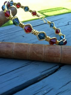 a close up of a bracelet on a wooden table