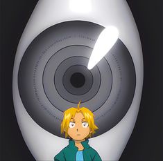 the young man is standing in front of an object that appears to be a spiral