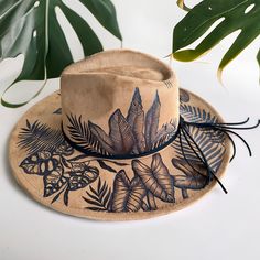 This Hat is Burned using Pyrography Techniques. Each Hat burned is drawn freehand therefore each one is a ONE of a KIND. Hats are all sprayed for weather and wear. Each Hat comes with a handcrafted Macrame Wall Hanger & a Signature Dust/Travel Bag. Derby Hat Diy, Pyrography Techniques, Burned Hats, Macrame Wall Hanger, Hat Diy, Painted Hats, Velvet Hat, Diy Hat, Derby Hat