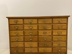 an old wooden dresser with many drawers