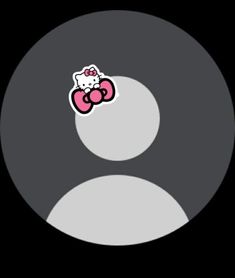 a hello kitty sticker sitting on top of a black circle with white circles around it