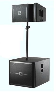 a speaker stands on top of a black box