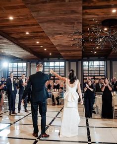 a bride and groom dancing at their wedding reception