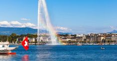 a boat is in the water with a rainbow coming out of it's spout