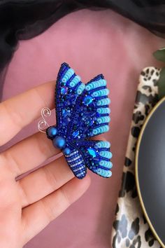 I made a blue butterfly brooch for you and for your lovers gift  Made with high quality materials like swarovski pearls, swarovski bi cone,japanes beads,italian sequins,toho bugle,gemstones,rhinestones,crystal beads  There is a unbreakable and stainless steel needle back of brooch  size is about 3.14 inches (8 cm )  You can send me message for your special questions  I can make your personalized design as a brooch or pendant  Don't miss discount over 200 Usd Handmade Turquoise Brooches As Gift, Handmade Turquoise Brooches For Gift, Unique Handmade Blue Brooches, Handmade Blue Brooches For Gift, Handmade Blue Pins For Gifts, Blue Brooch Pins As A Gift, Blue Brooch Pin As Gift, Blue Brooch Pin For Gift, Blue Brooch Pins For Gift